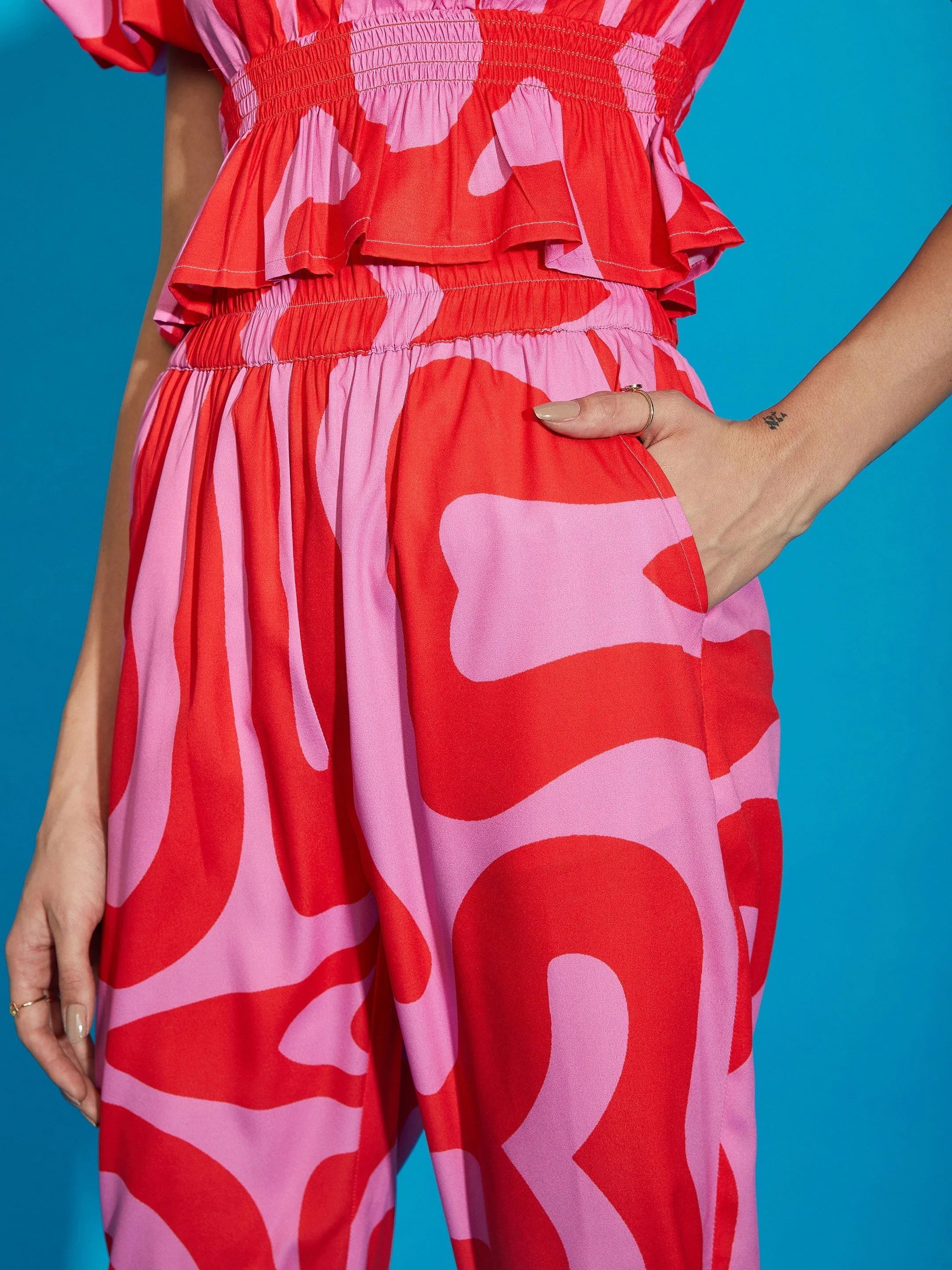 Women Pink Abstract Print Peplum Top With Tapered Pants