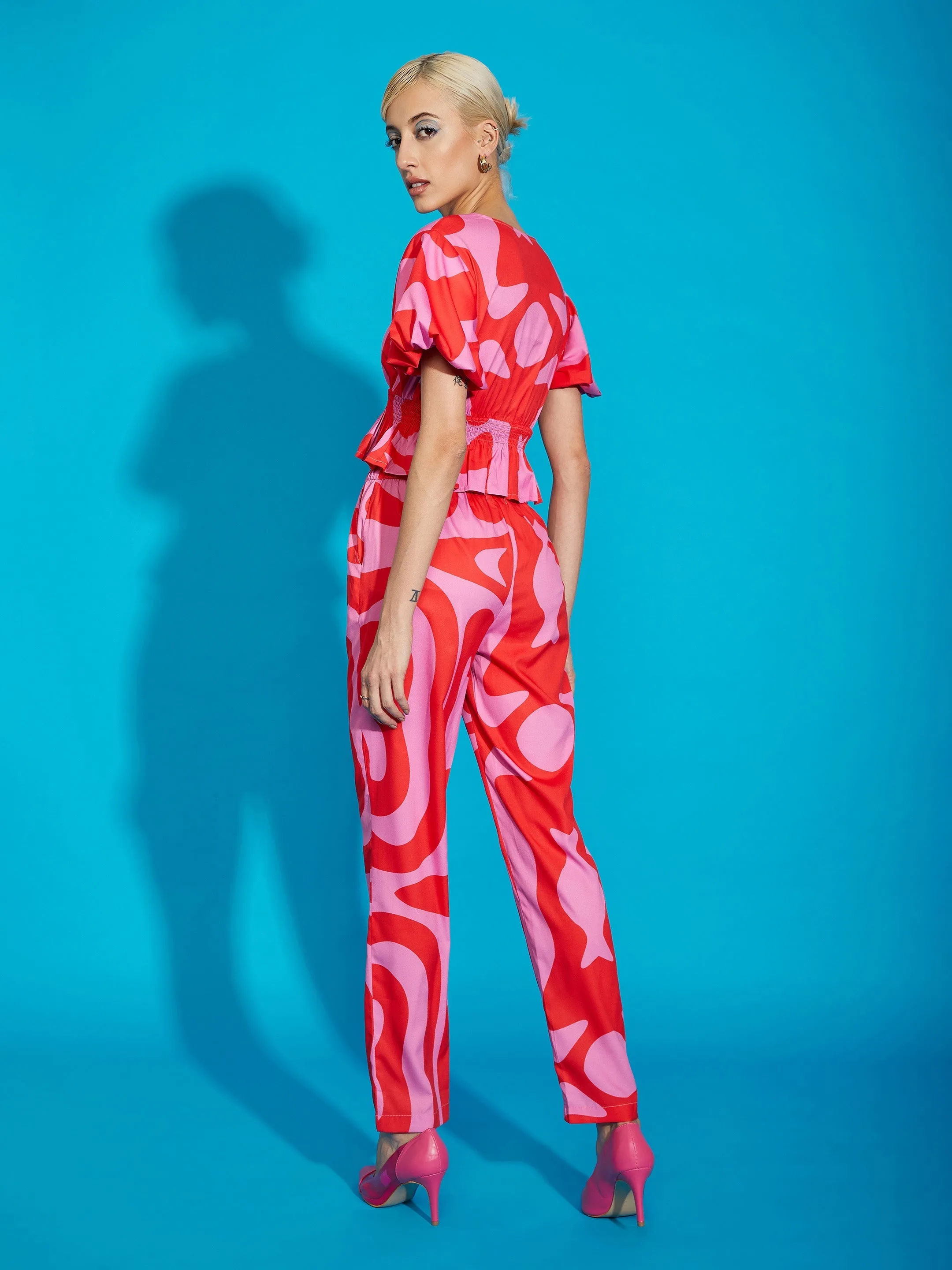 Women Pink Abstract Print Peplum Top With Tapered Pants