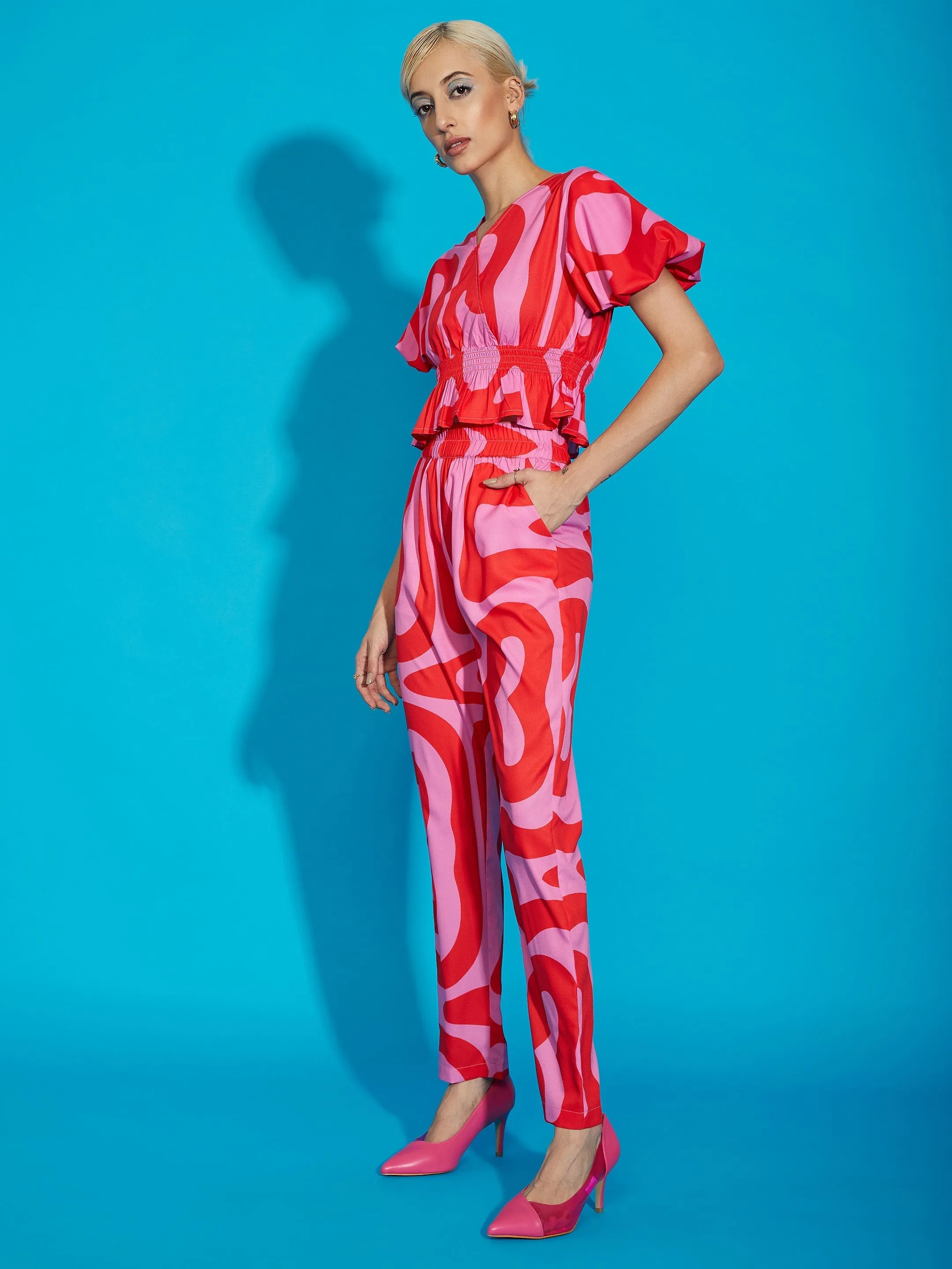 Women Pink Abstract Print Peplum Top With Tapered Pants